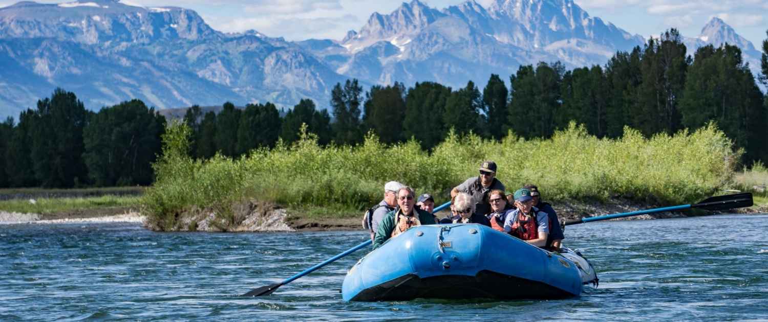 Tourists exploring the Snake River in a raft